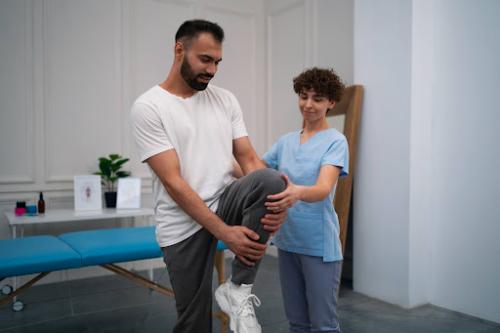 athletic trainer doing leg stretch exercises with an industrial athlete mobile medical corporation occupational health and safety 