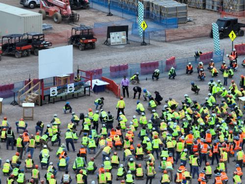 construction workers performing daily stretch and flex routines mobile medical corporation mmc 