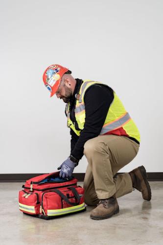 emt vs paramedic medical professional unpacking bag of supplies mobile medical corporation