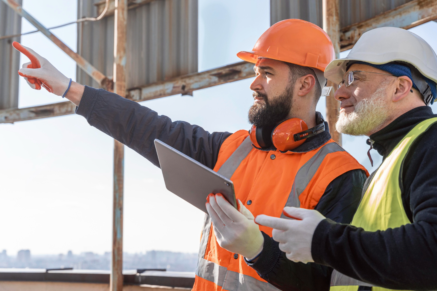 two construction workers train together construction site safety mobile medical corporation 