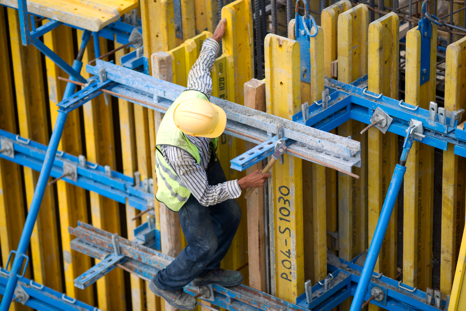 construction worker at jobsite on high beam national minority health month mobile medical corporation